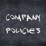 "Company Policies" written in white chalk lettering on a dark chalkboard