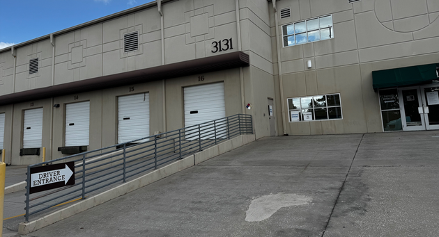 Warehouse loading dock bays with railings beside building number 3131