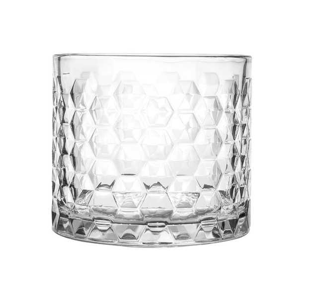 Empty clear glass candle jar with a faceted geometric diamond pattern on a white background